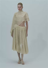 Load and play video in Gallery viewer, Flowy high-neck cropped blouse in cream dots print
