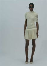 Load and play video in Gallery viewer, Drop-waist wrap mini dress in beige
